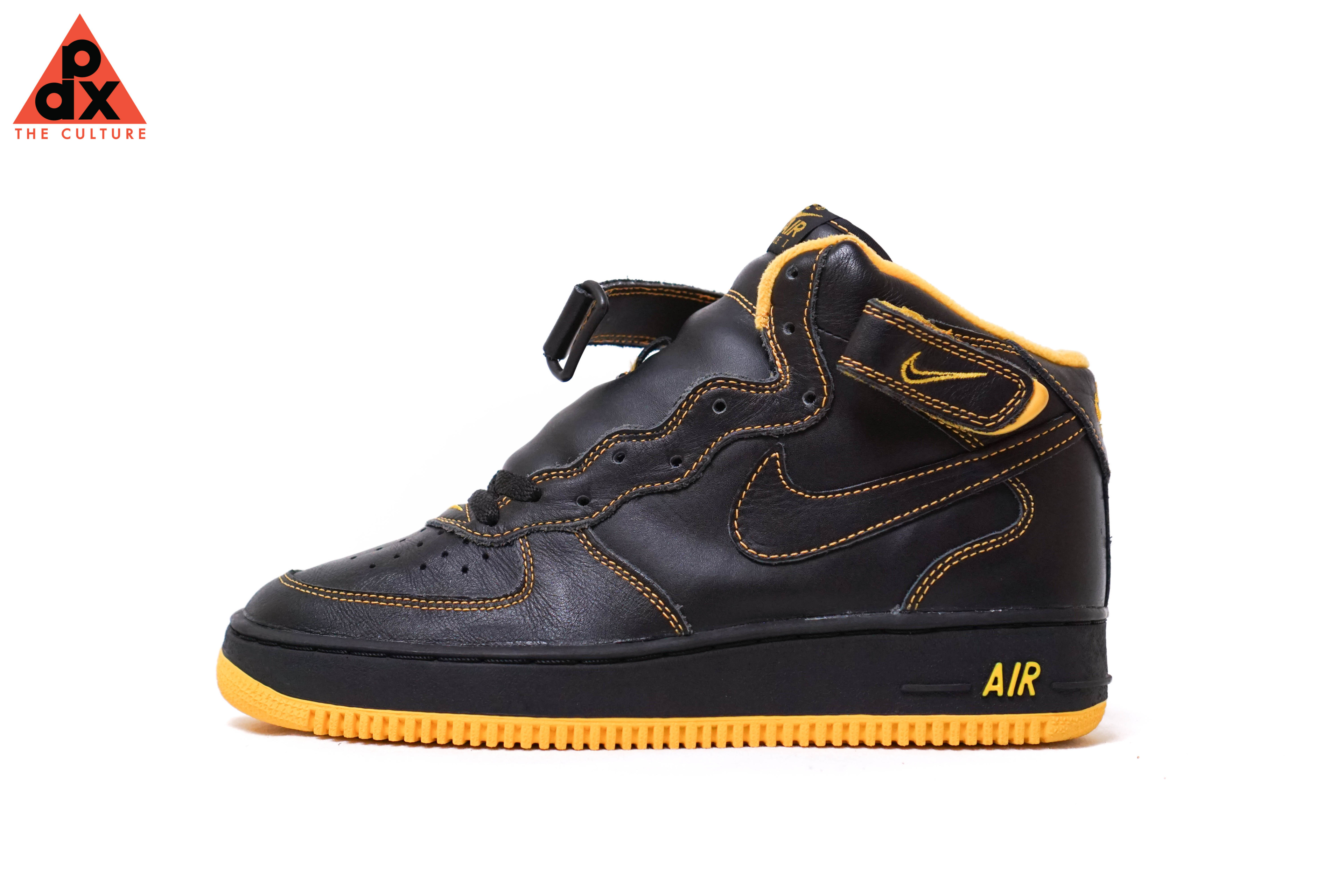 black and yellow air force 1 mid